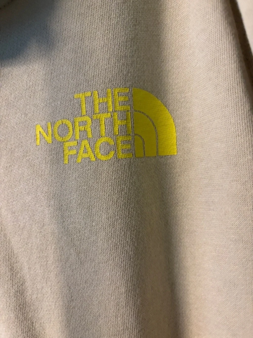 The North Face Men's Crewneck Hoodie in Cream with Yellow Logo